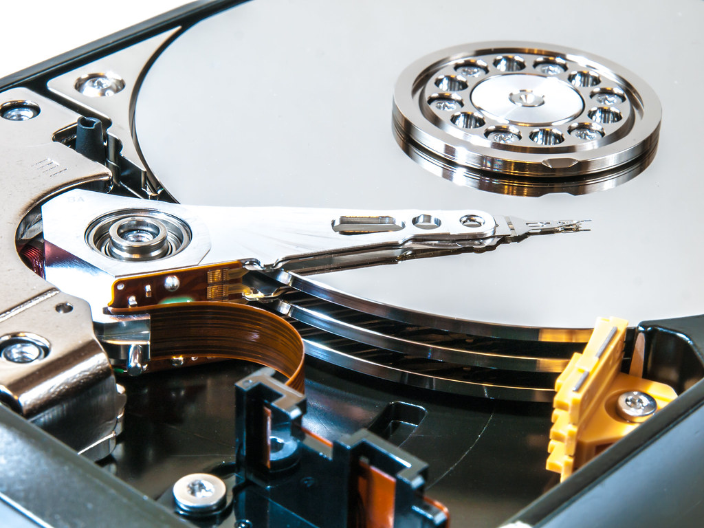 Close-up of an open computer hard drive, representing data backup and storage