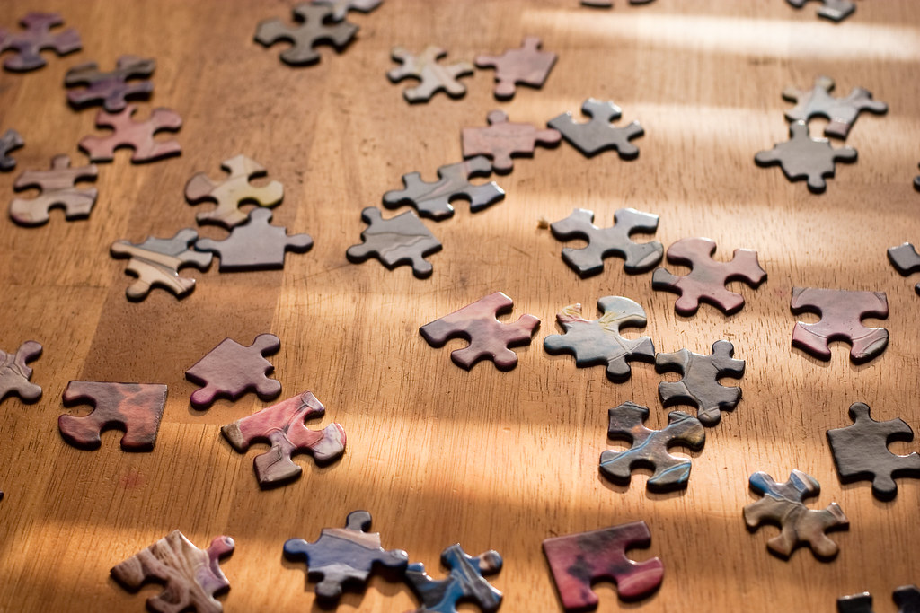 Jigsaw puzzle pieces fitting together, representing WordPress plugins working together