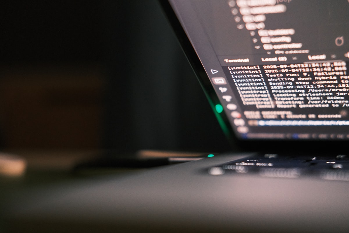 Laptop screen showing code, representing vehicle schema markup JSON-LD for dealer SEO